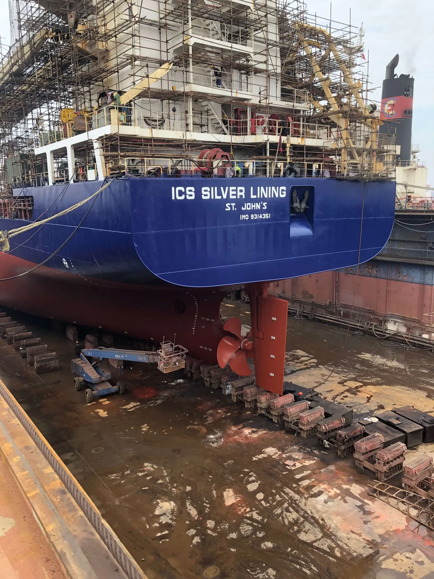 Her stern and rudder on the blocks in dry dock, the name ICS Silver Lining and St John's painted across the transom.